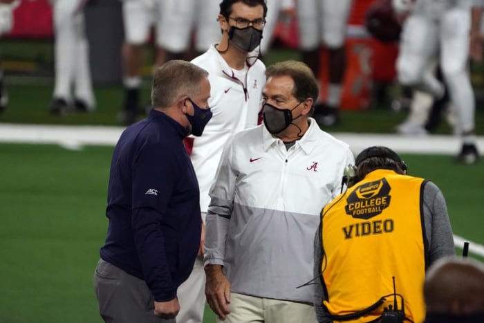 Jan 1, 2021; Arlington, TX, USA; Alabama Crimson Tide head coach Nick Saban and Notre Dame Fighting Irish head coach Brian Kelly meet on the field before the Rose Bowl at AT&T Stadium. Mandatory Credit: Kirby Lee-USA TODAY Sports